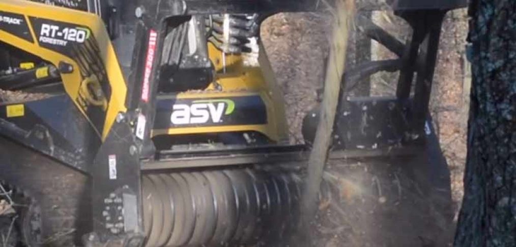 closeup of forestry mulching machine doing land clearing