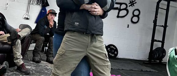 Tree worker practicing rescue training in the woods in Bloomington, IN