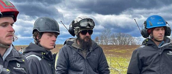Tree worker in safety gear during rescue training in Bloomington, IN