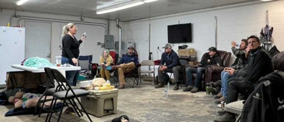 Professional Arborist Explaining Aerial Rescue Instructions to Instructors in Bloomington, in