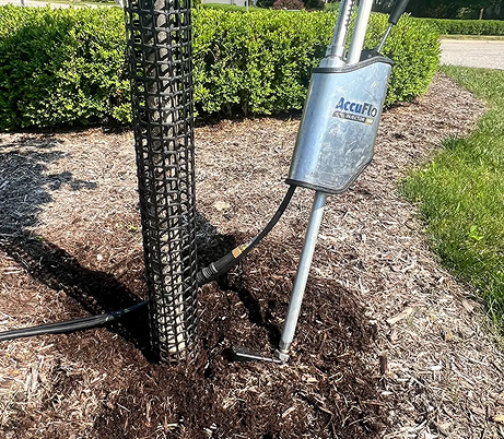 Tree root care treatment being applied using professional soil injection equipment